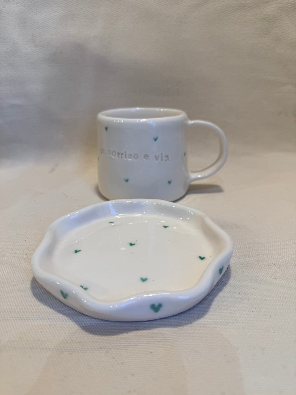 Tazza con piattino "Un sorriso e via"