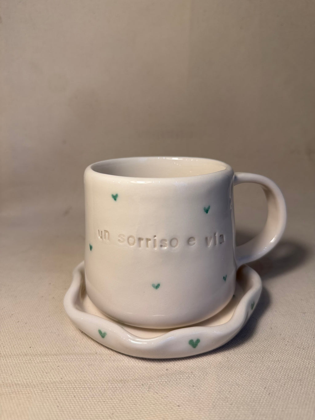 Tazza con piattino "Un sorriso e via"